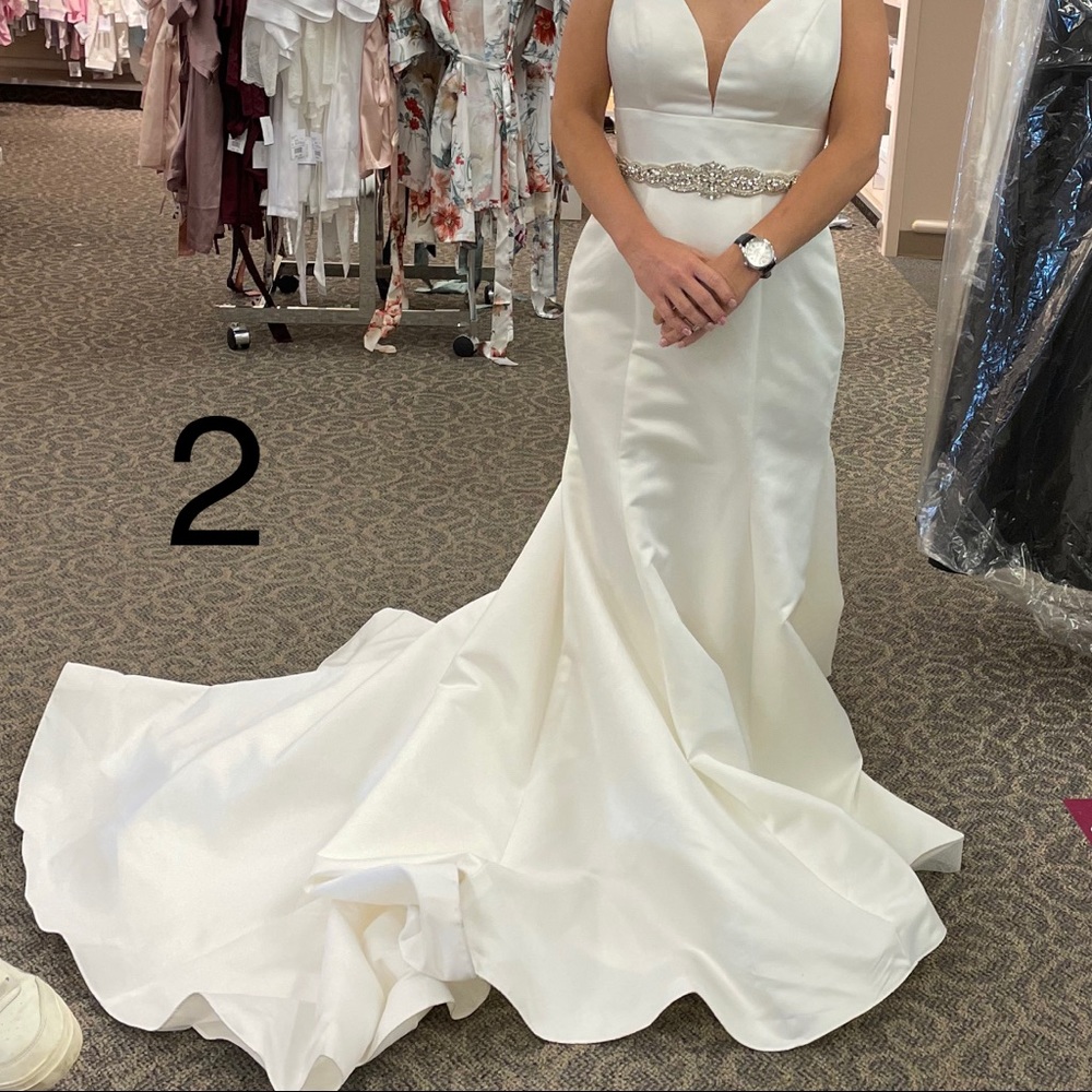 New with tags, size 6 wedding gown.
